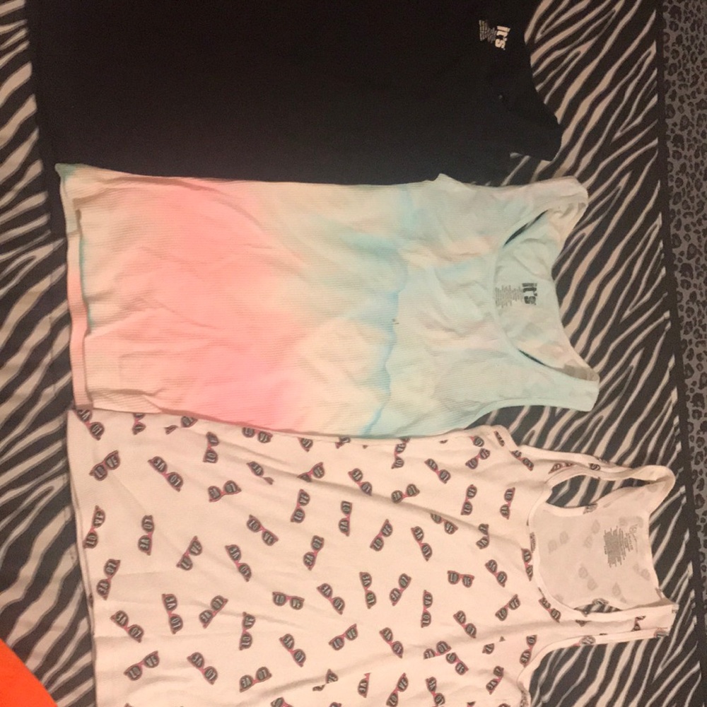 3 workout tanks and 1 regular tank 2 black ones